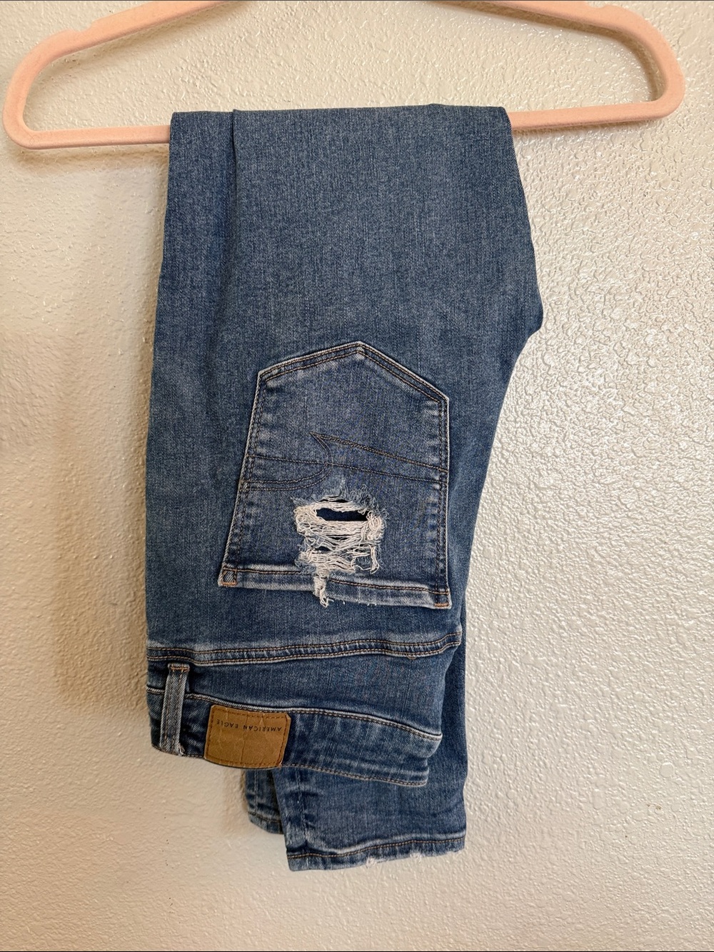 American Eagle Outfitters Medium Blue Skinny Jeans with Distressed Back Pocket